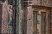 Banteay Srei temple - sculpted devata figure in niches 